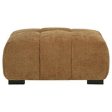 Octavia ottoman side view showing amber fabric and wood legs