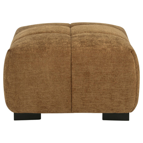Close-up on amber fabric texture and tufting of Octavia ottoman