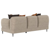 Close-up of sculpted track arm design on sofa