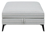 Clint upholstered ottoman showing tapered legs detail