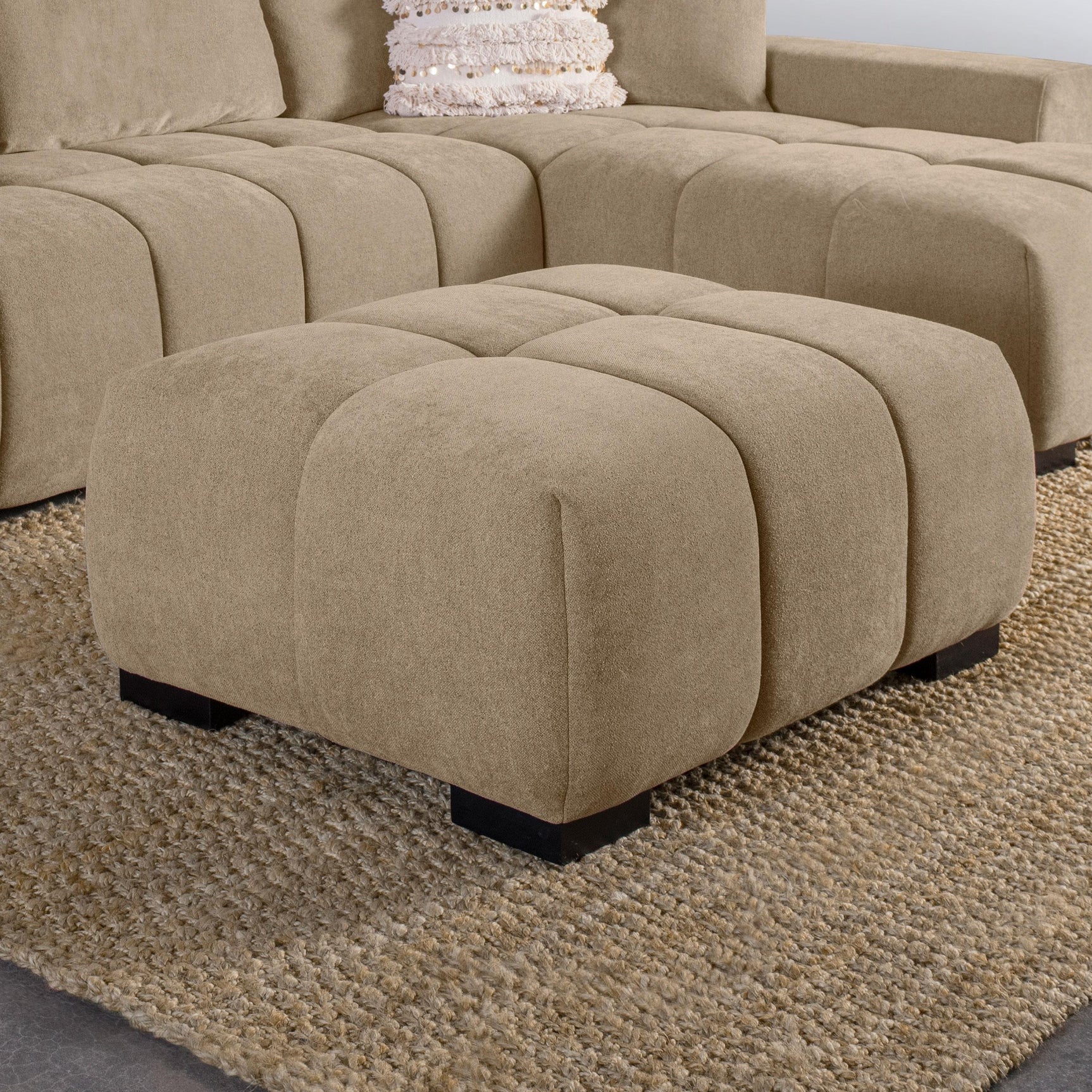 Detailed view of grid tufting on Octavia ottoman