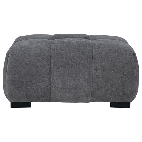 Close-up of charcoal grey fabric and tufting on Octavia Ottoman