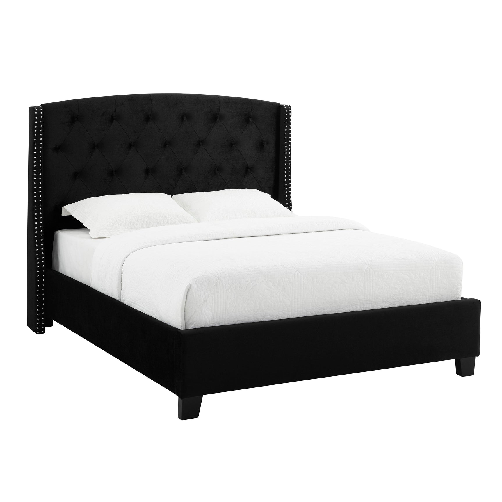Close-up of tufted black velvet upholstery on headboard