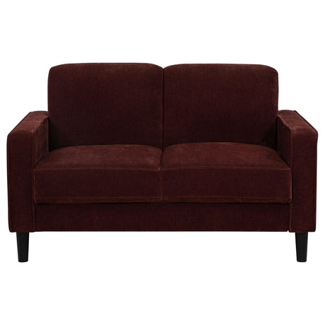 Ruth loveseat side view showing track arm