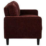 Detailed view of plastic legs beneath loveseat