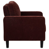 Attached plush cushions with piping detail on Ruth chair