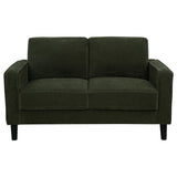 Side view of Ruth fabric upholstered loveseat in matcha green