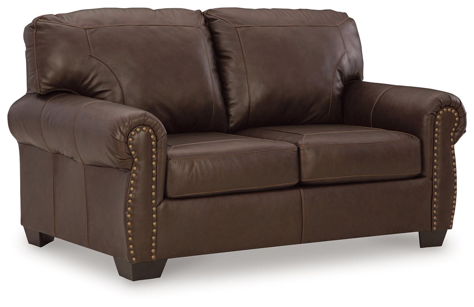 Colleton loveseat angled side view showing nailhead trim