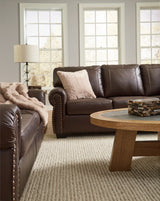 Detail of Colleton dark brown sofa and loveseat armrest