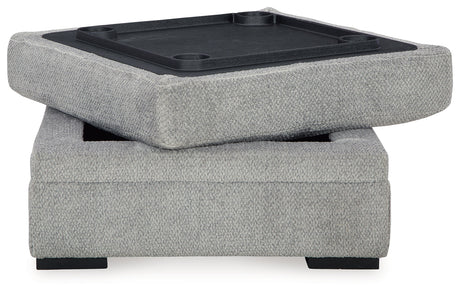 Ottoman top flipped up revealing cup holders