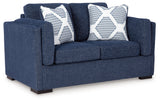 Angled side view of Evansley Navy Sofa and Loveseat