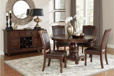 main view of Lordsburg brown cherry round dining table with four faux leather upholstered chairs