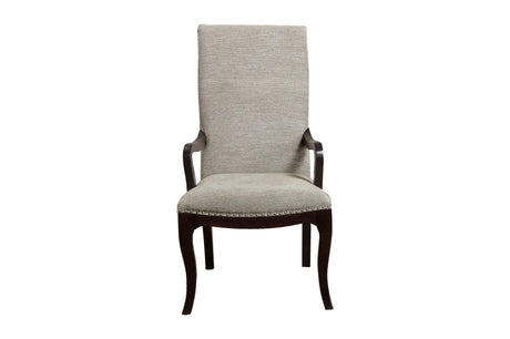 angled view of Savion Dining Set with chairs arranged around round table