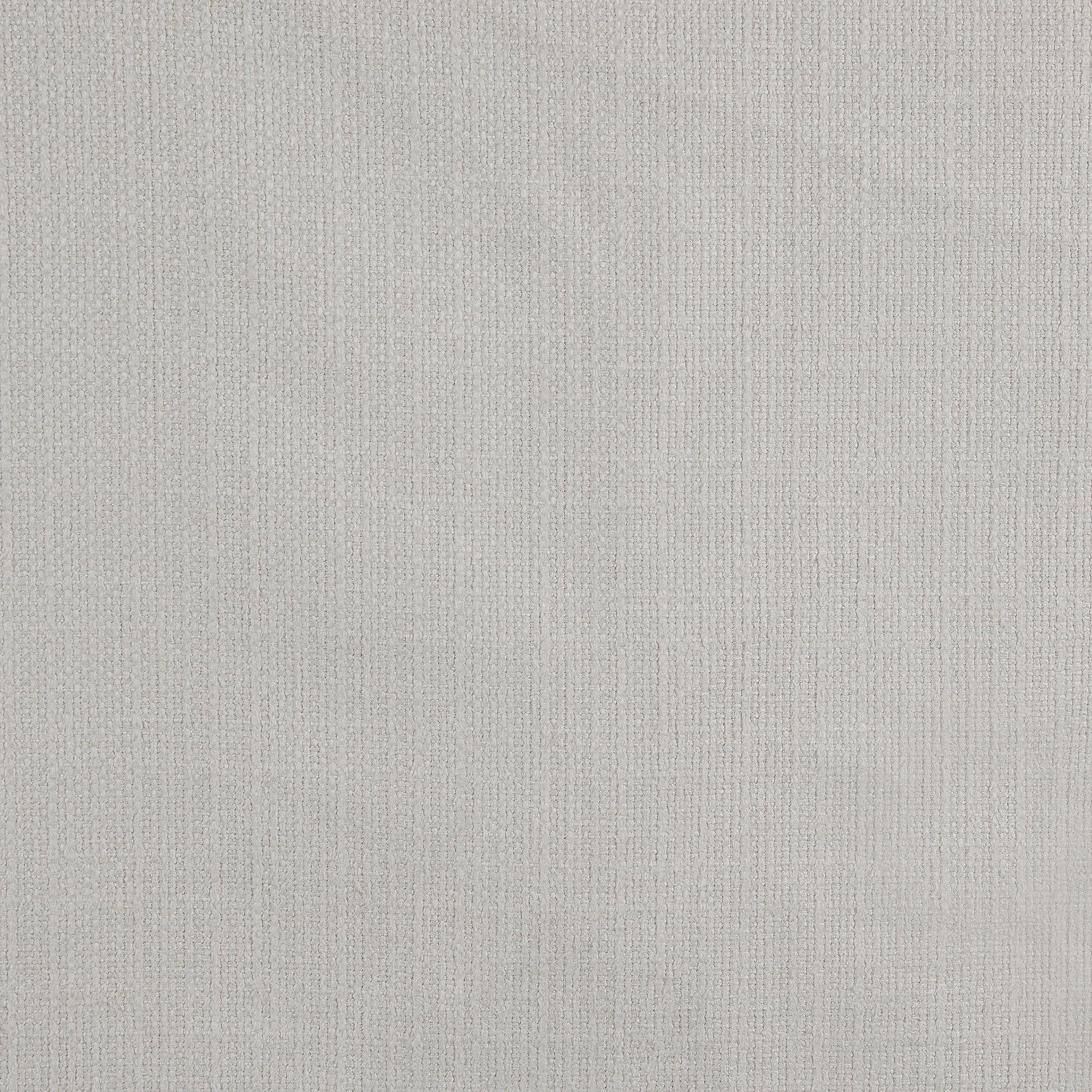 Close-up detail of fabric upholstery on sectional sofa