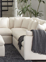 Front view of Hobson ottoman highlighting tufted seat and stitching