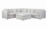 Side angle showing plastic feet and wood frame of Hobson ottoman