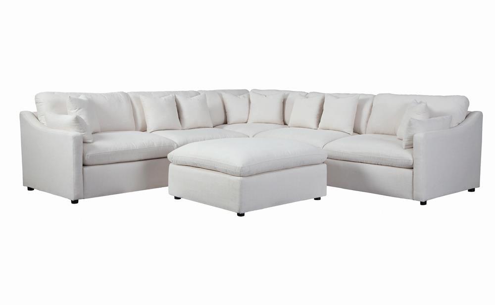 Side angle showing plastic feet and wood frame of Hobson ottoman