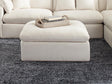 Hobson off-white upholstered ottoman with tufted cushion seat, angled front view