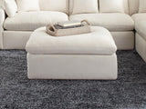 Hobson off-white upholstered ottoman with tufted cushion seat, angled front view
