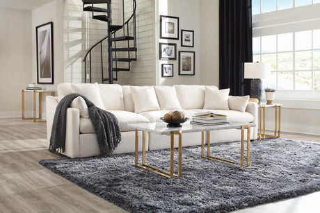 Hobson ottoman in off-white fabric displayed in living room setting