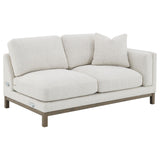Textured boucle upholstery detail on sectional sofa