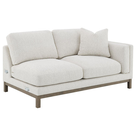 Textured boucle upholstery detail on sectional sofa