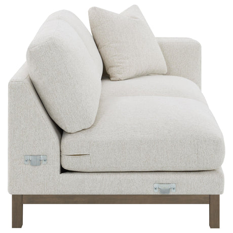 Room setting with sectional sofa and chaise in sand