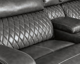 Close-up detail of gray faux leather upholstery and stitching on Samperstone sectional