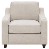 Christine beige upholstered cushion back chair side angle with arms
