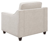 Christine beige upholstered cushion back chair angled view