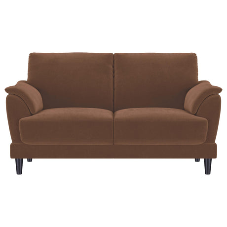 Side view showing espresso wood tapered legs of Selma loveseat