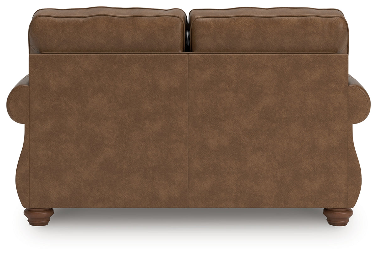Chasemore Loveseat side view showing profile of turned legs and cushions