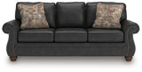 Close-up of jumbo stitching and accent nails on sofa upholstery