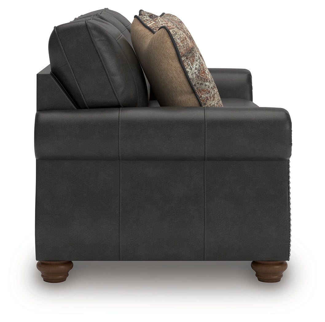 Detail view of sofa arm and stitching