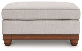 Clearbrooke Ottoman head-on view highlighting sandstone upholstery