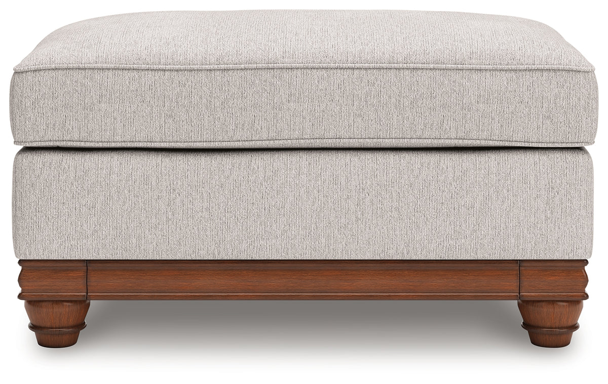 Clearbrooke Ottoman head-on view highlighting sandstone upholstery