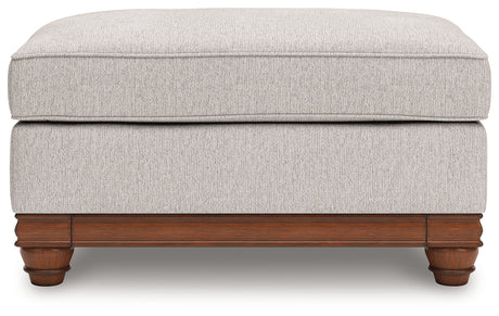 Clearbrooke Ottoman head-on view highlighting sandstone upholstery