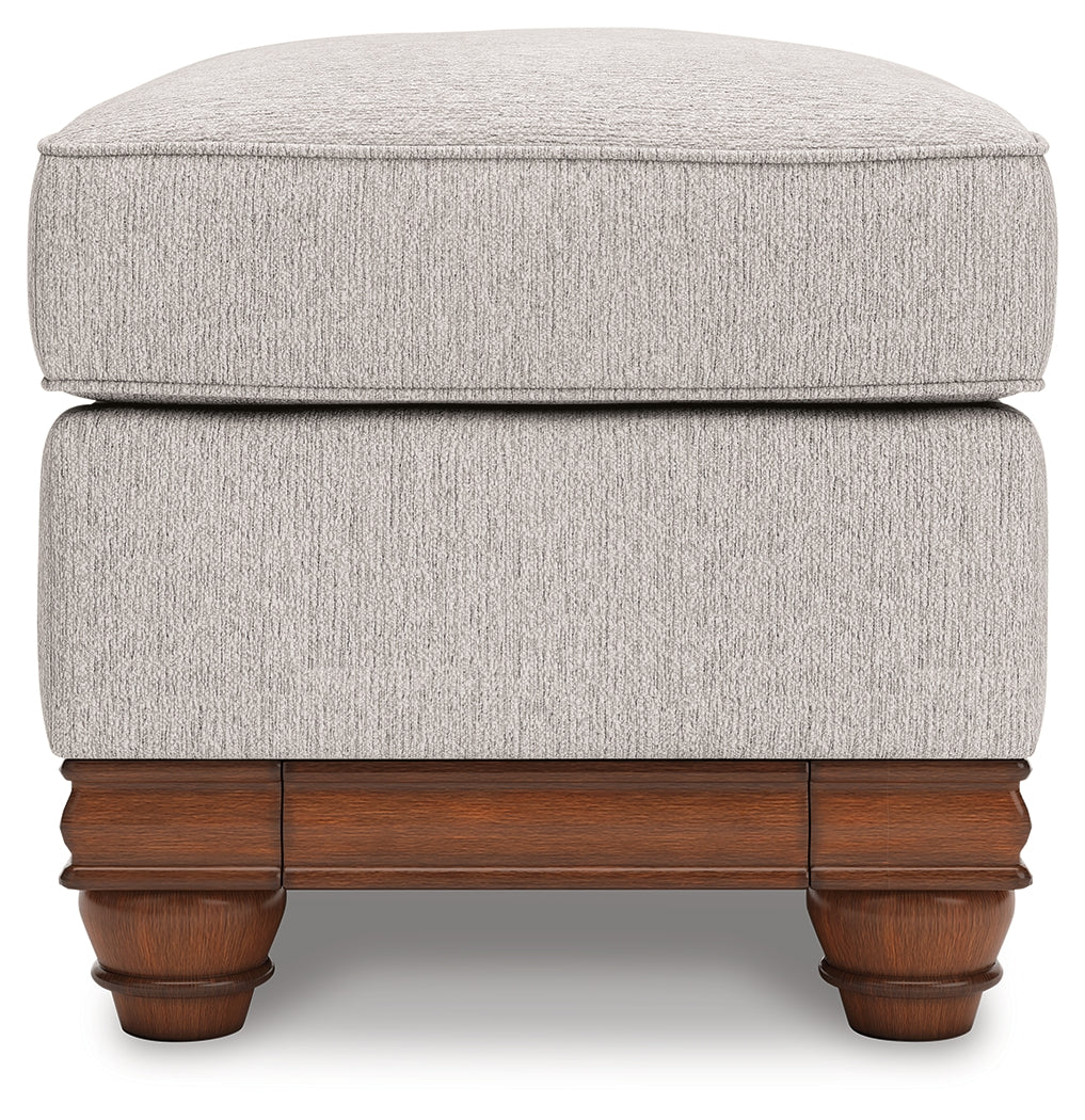 Chair and ottoman side angle showing wraparound base