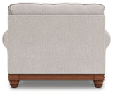 Chair and ottoman set styled in living room