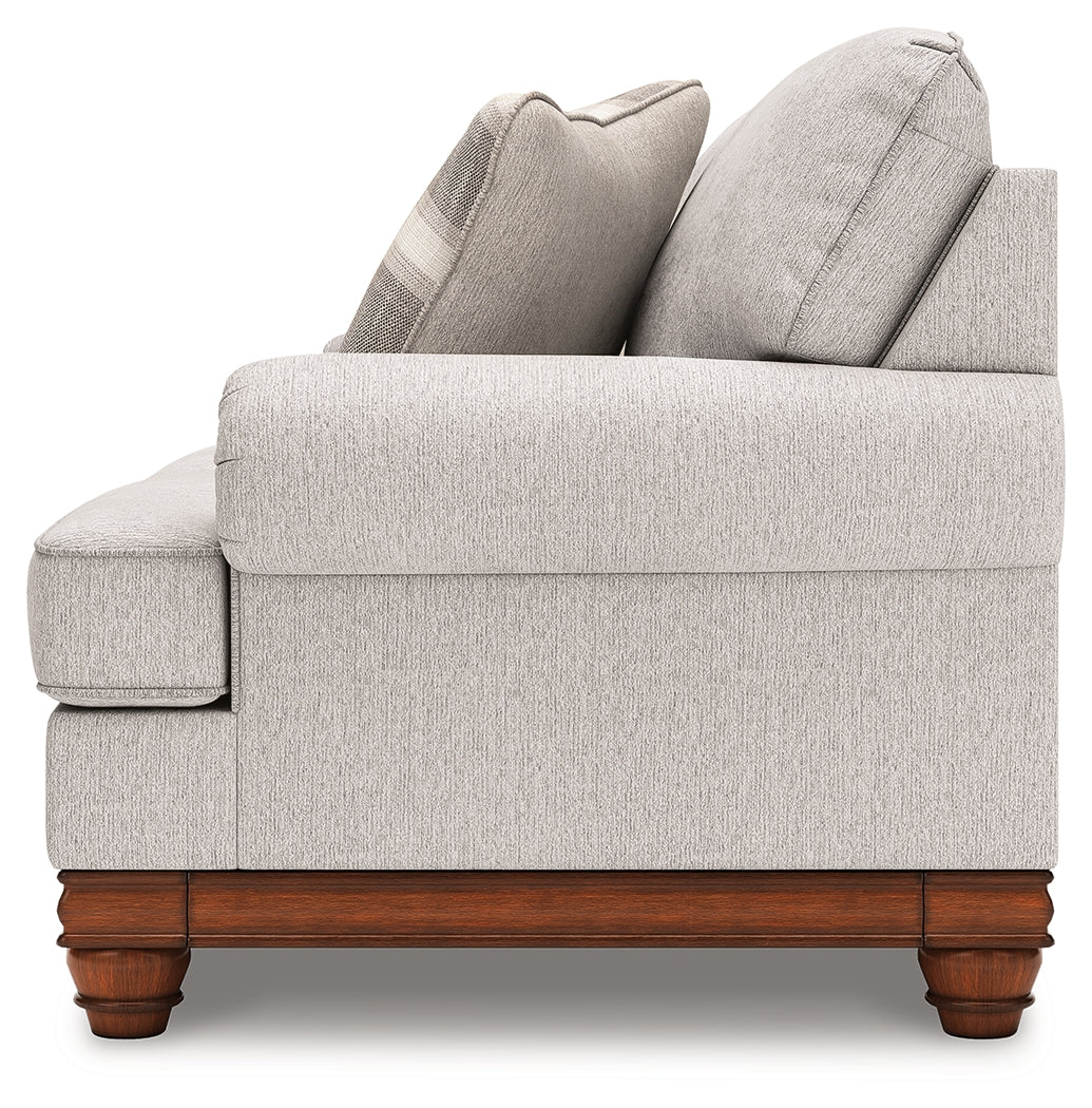 Clearbrooke loveseat side angle highlighting turned legs
