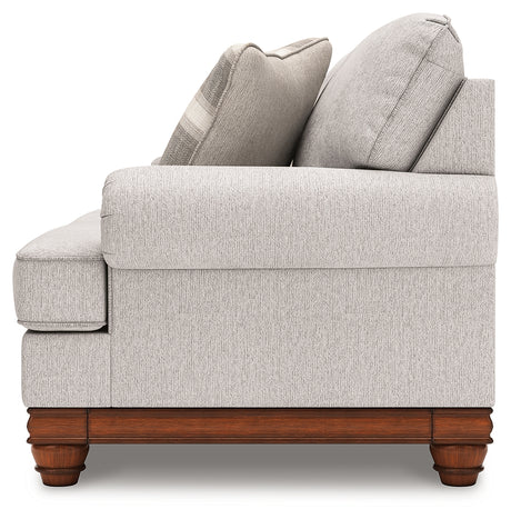 Clearbrooke loveseat side angle highlighting turned legs