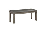 Side view of dining bench upholstered in gray faux leather