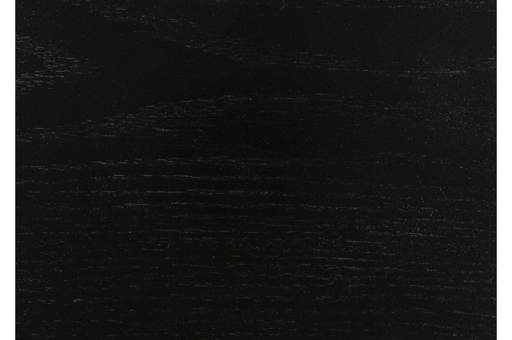 Side angle detail of dining table and arm of chair