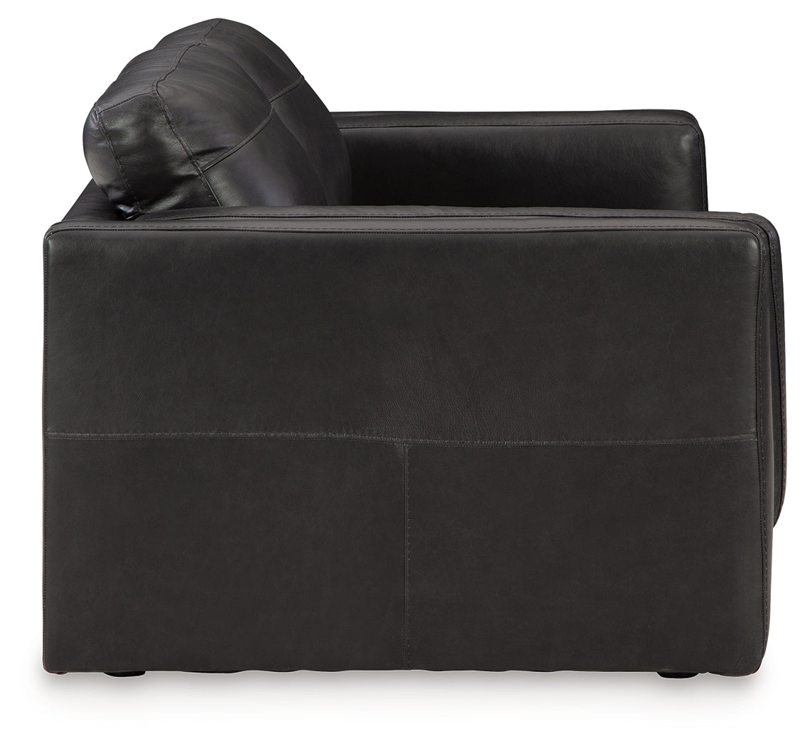 Close-up of chair armrest and upholstery