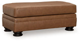 Carianna Ottoman side view showing turned leg