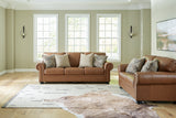 Side view of Carianna Caramel Sofa and Loveseat furniture