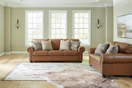 Side view of Carianna Caramel Sofa and Loveseat furniture