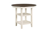 close-up of antique white table leg and light brown fabric chair upholstery