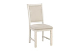 Side detail of chair upholstery and antique white finish