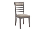 Side detail of gray fabric dining chair